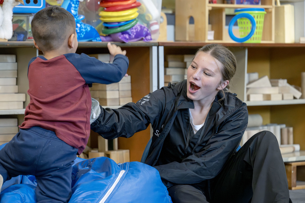 Child Family Services student working with a child during class
