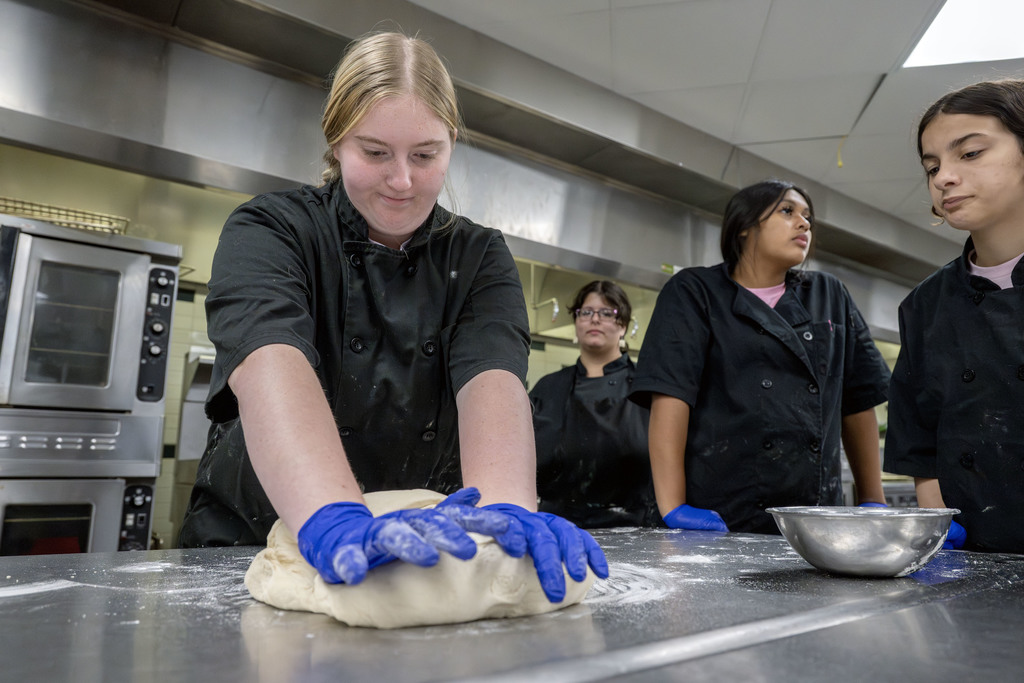 Culinary students working in class