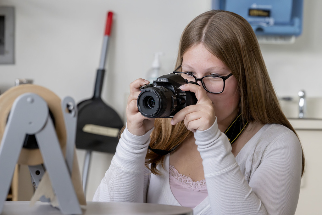 Visual Communications student working in class