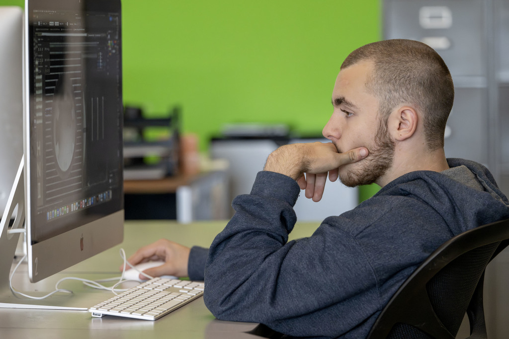 Visual Communications student working in class