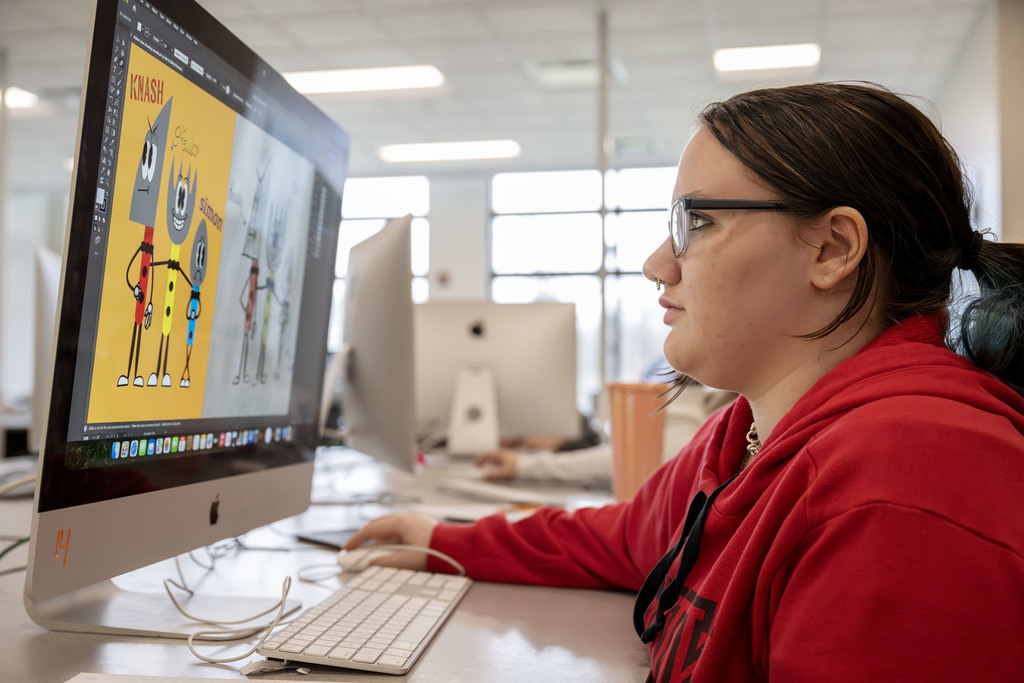 Visual Communications student working in class