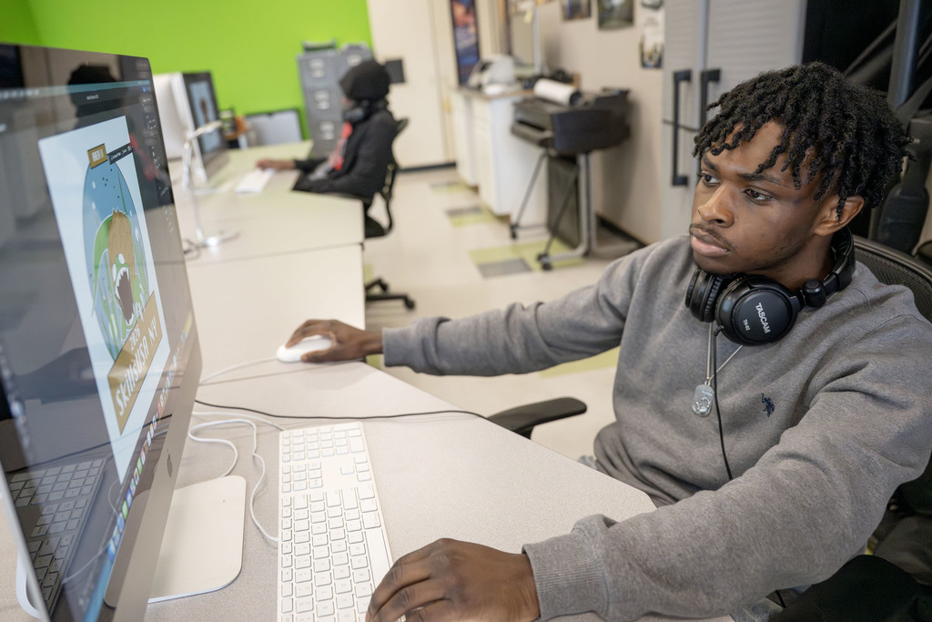 Visual Communications student working in class