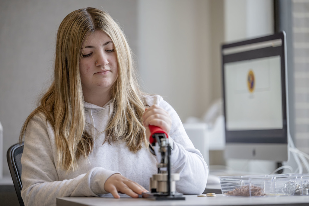 Visual Communications student working in class