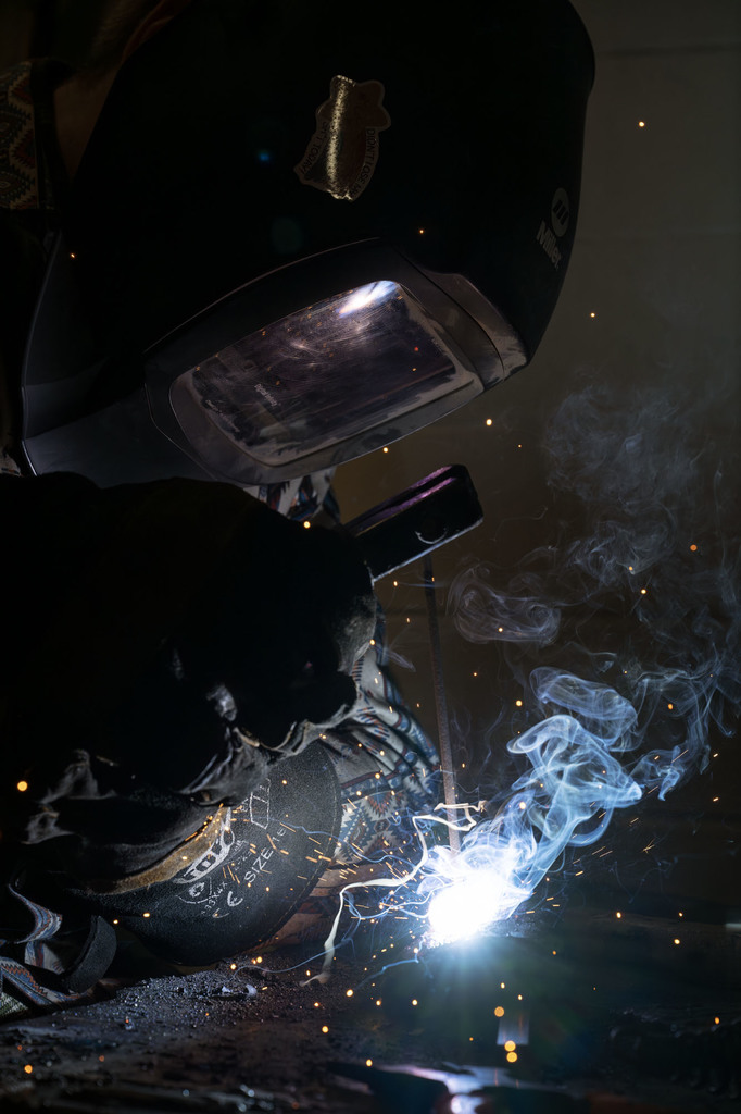 Welding student working in class
