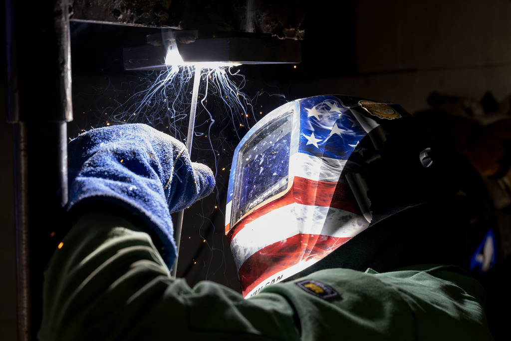 Welding student working in class
