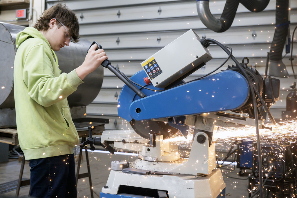 Welding student working in class