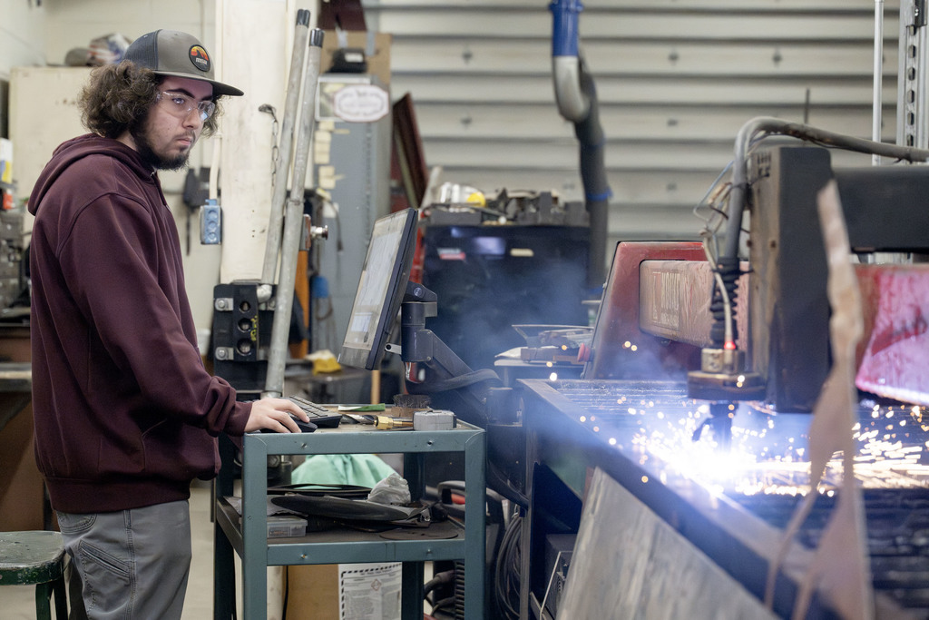 Welding student working in class