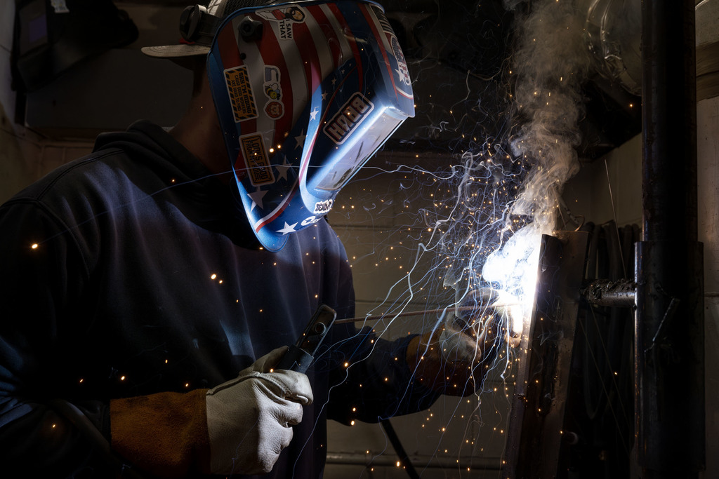 Welding student working in class