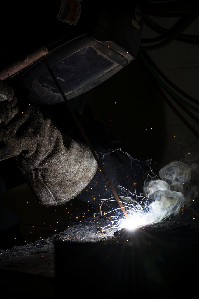 Welding student working in class