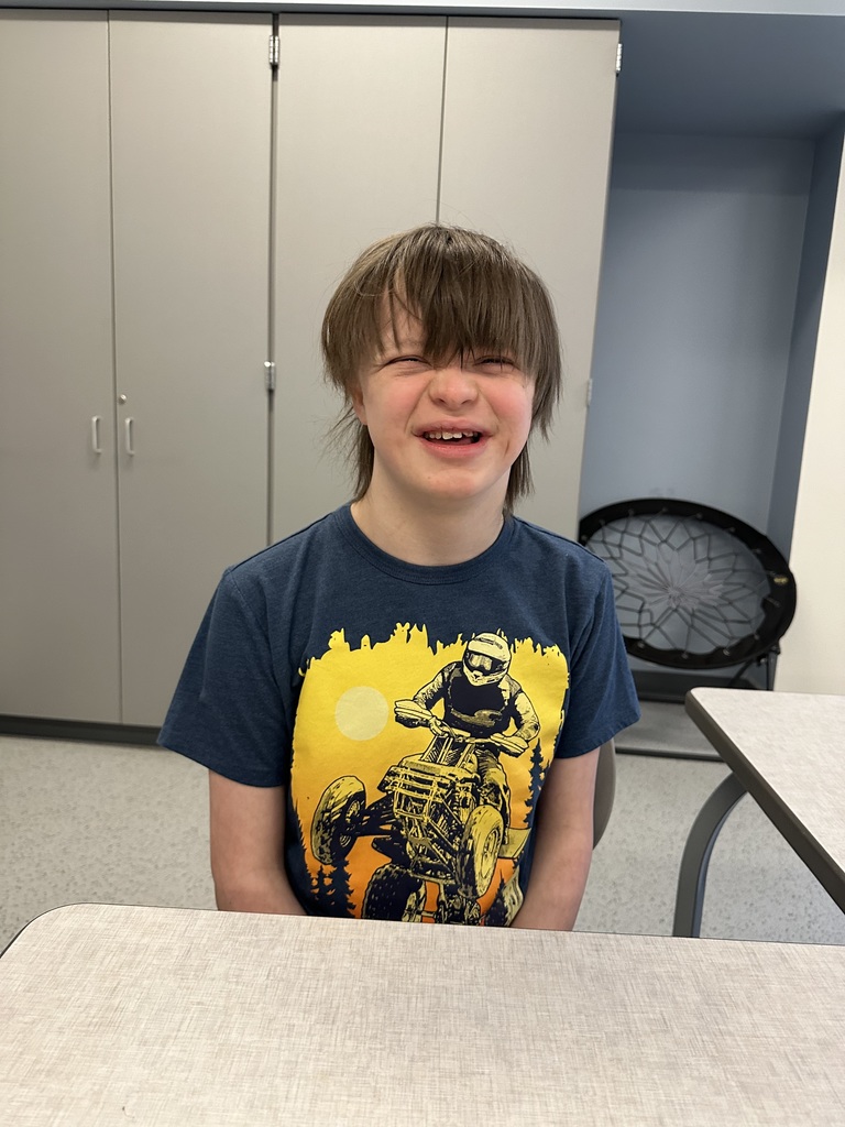 Special Programs student before haircut with long hair