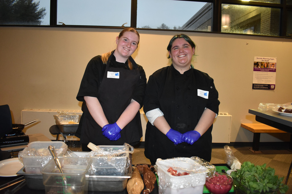Two culinary students at crepes station