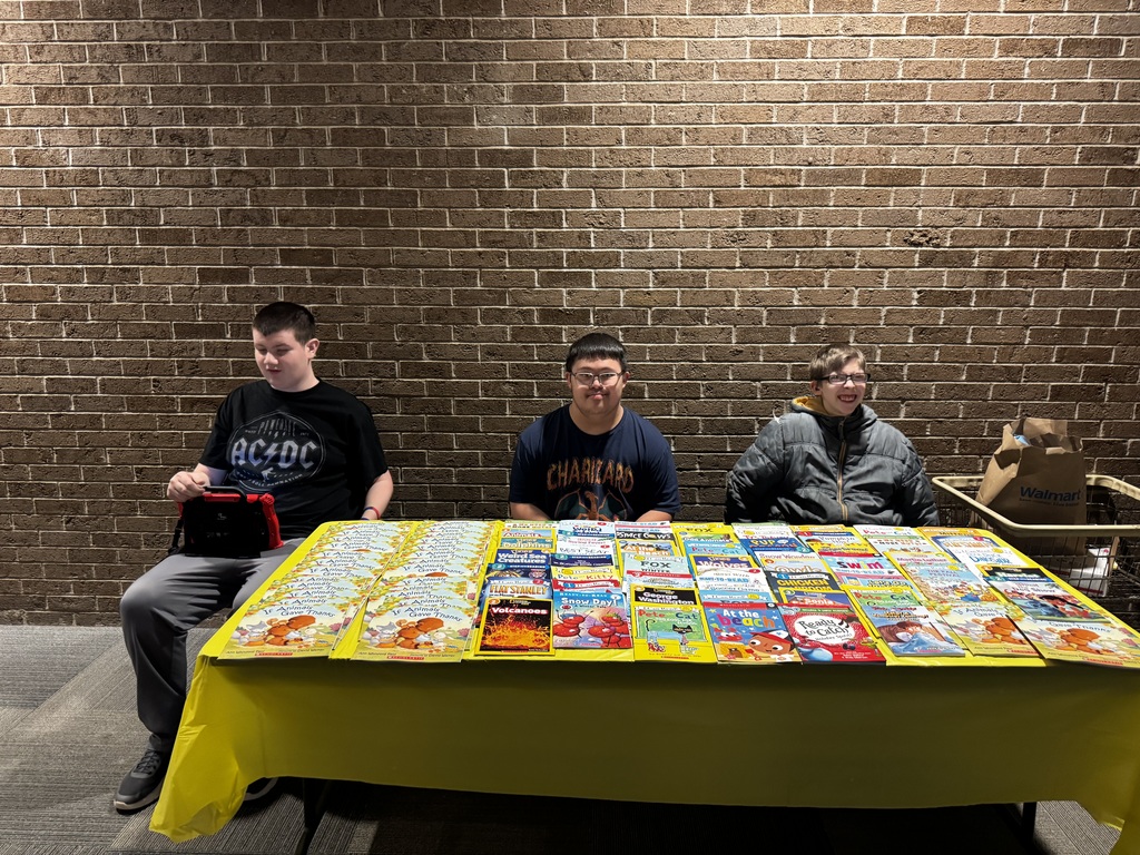 Three students at table