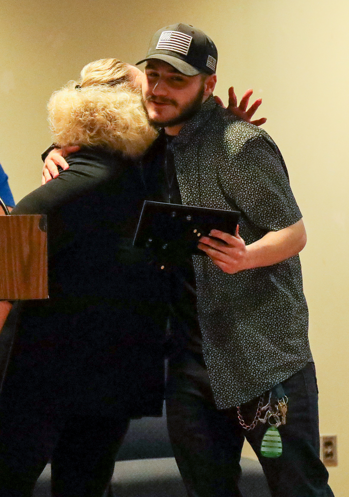 Cheri Evangelisa and Michael Grecco hugging
