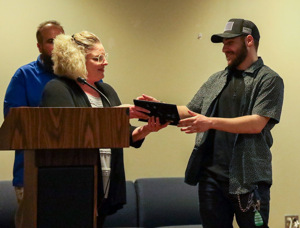 Cheri Evangelista presents Student Spotlight Award to Michael Grecco with Adam Spatto behind them