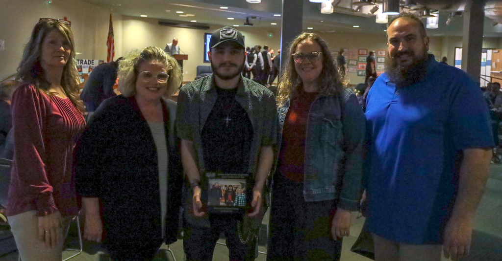 Student Spotlight Award winner Michael Grecco and four others pose as he holds his award