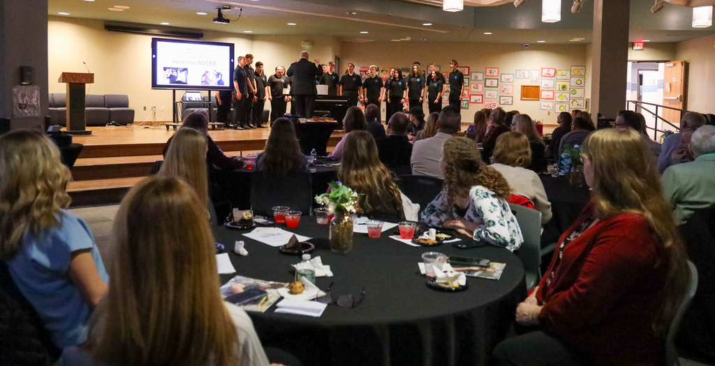 Director Mark Bunce and students in the Central Valley Chamber Choir perform on stage