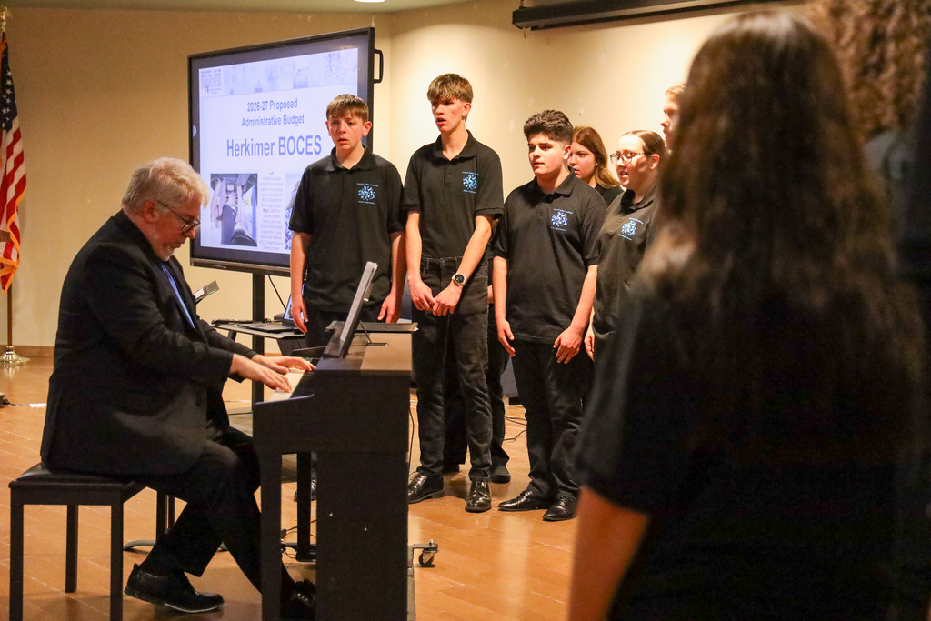 Director Mark Bunce and students in the Central Valley Chamber Choir perform on stage