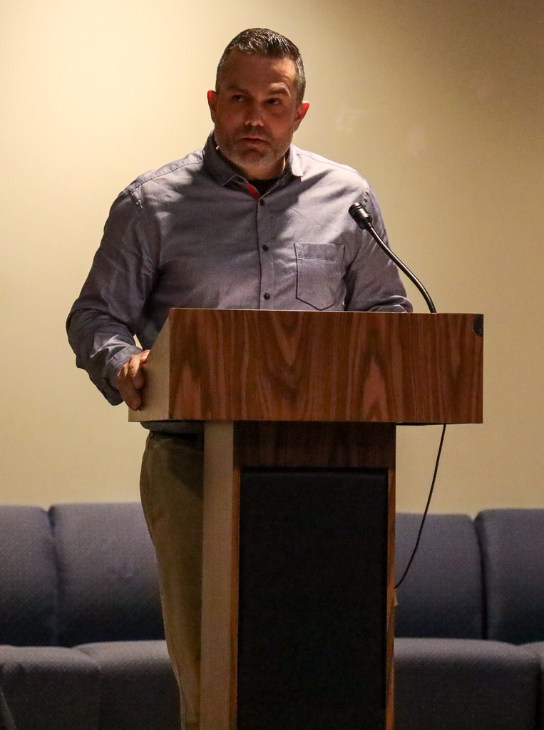 Man speaking at podium