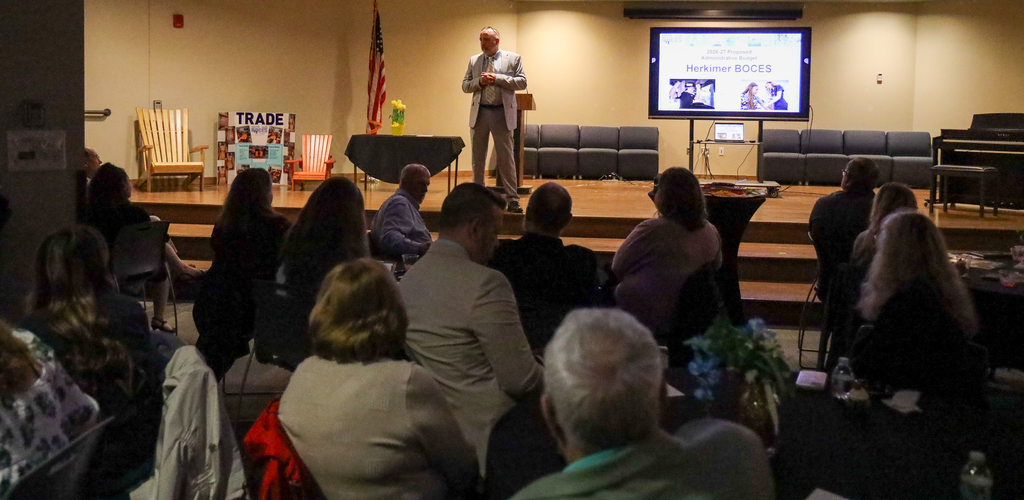 D.J. Shepardson speaking on stage