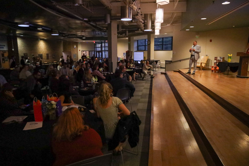 D.J. Shepardson speaking on stage