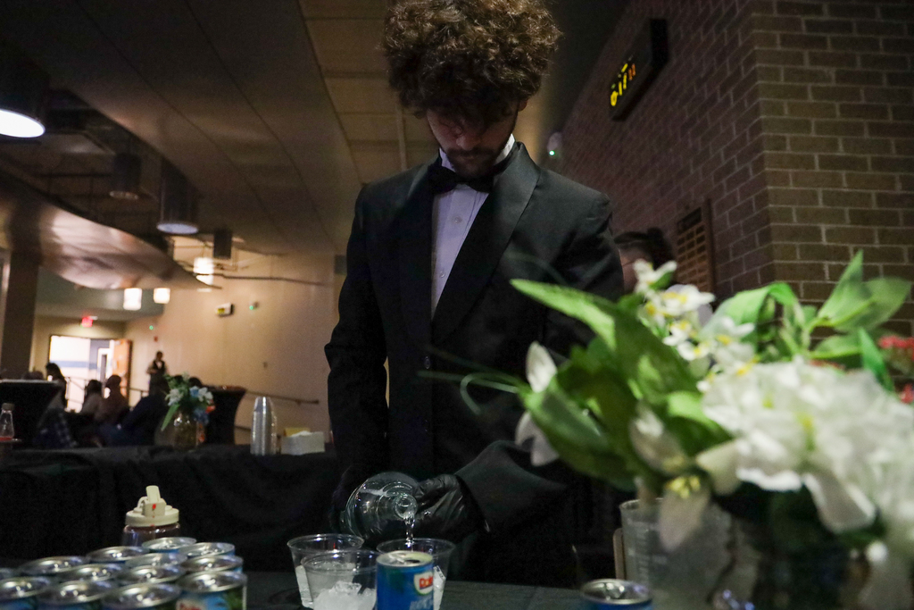 Culinary student serving drinks