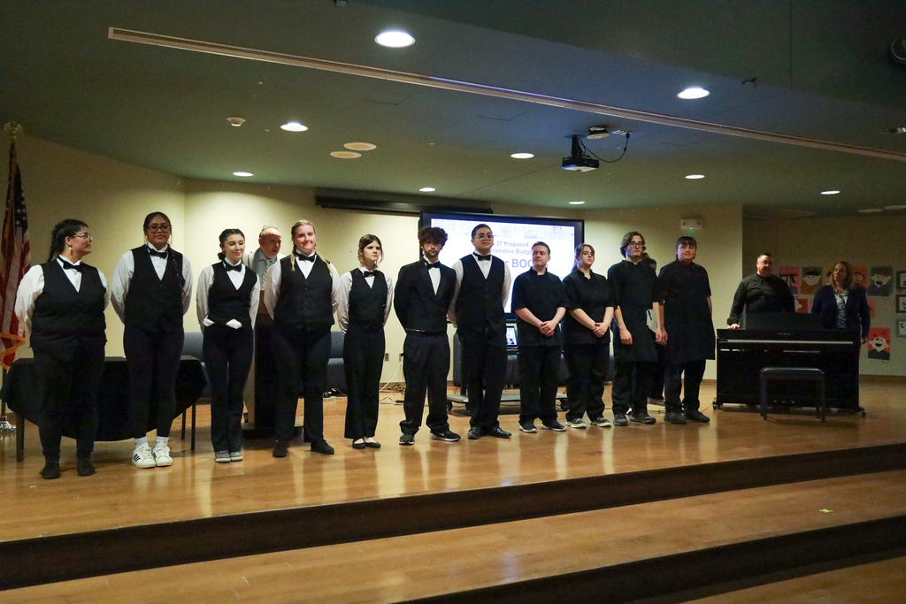 Culinary students posing on stage