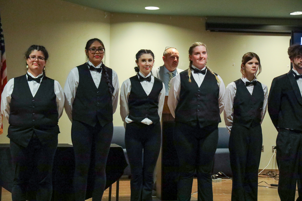 Culinary students posing on stage
