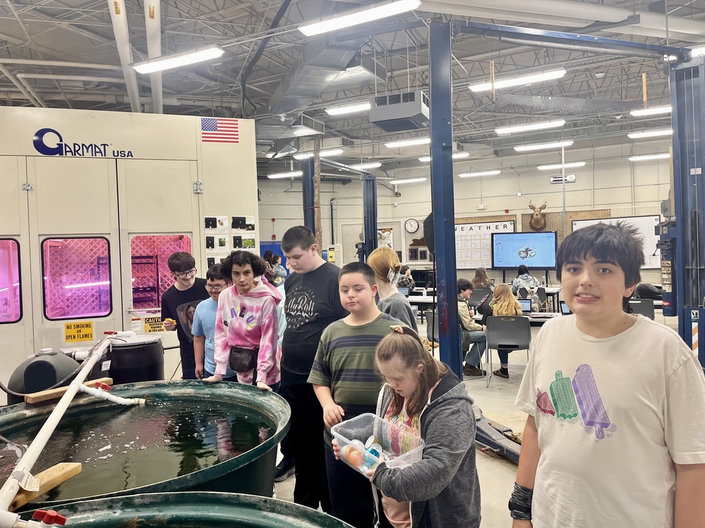 Career Prep students in Conservation classrom by fish tanks