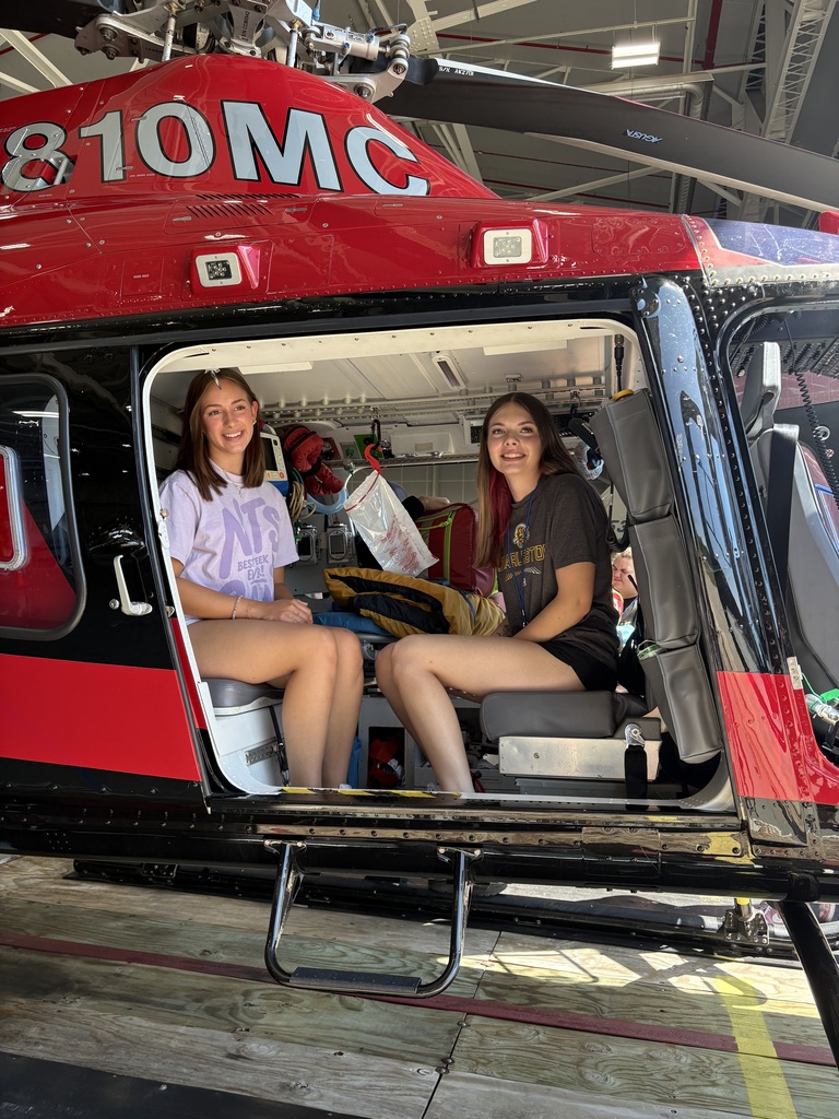 Two students sitting in helicopter