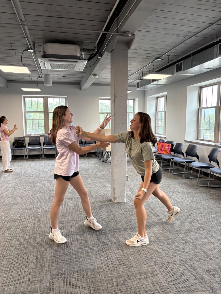 Two students practice self defense with each other