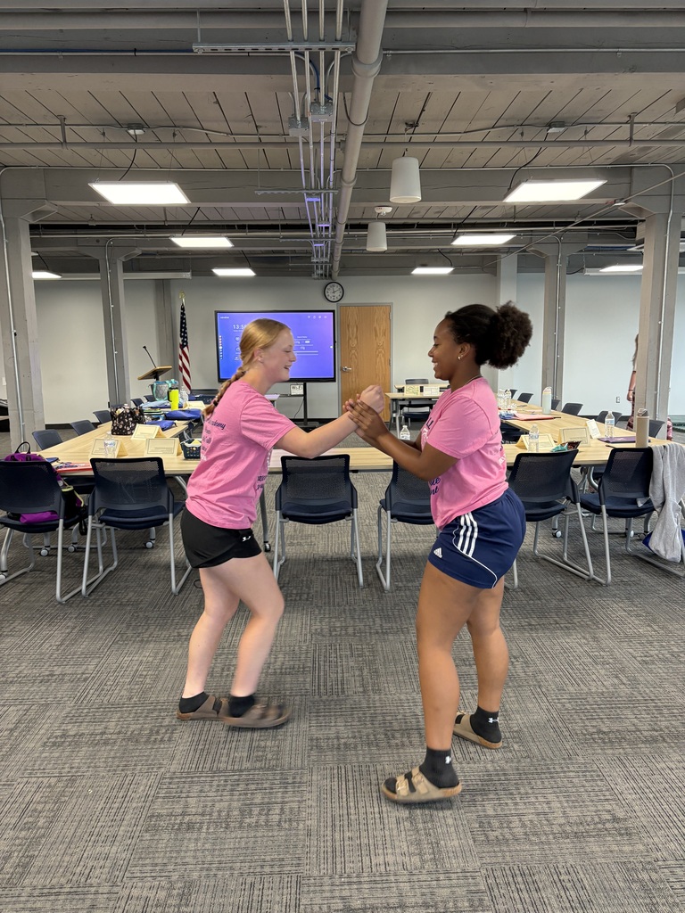 Two students practice self defense with each other