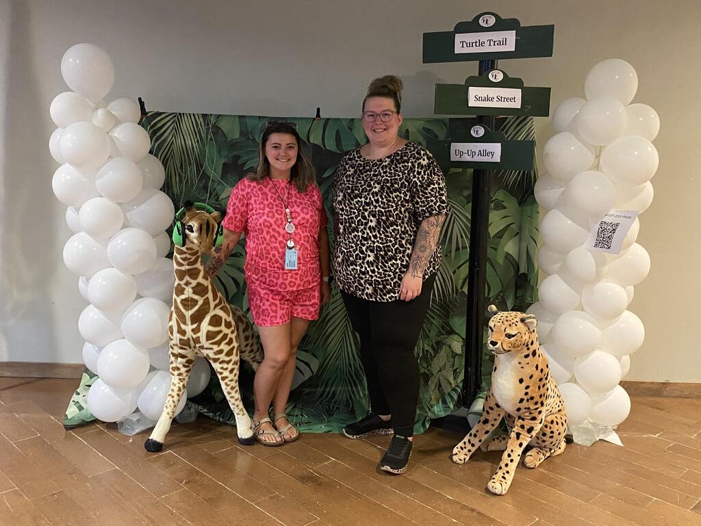 two people by zoo display