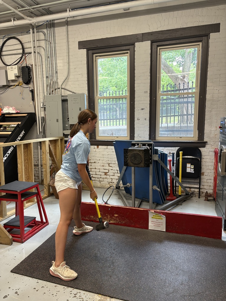 Student holding a sledgehammer