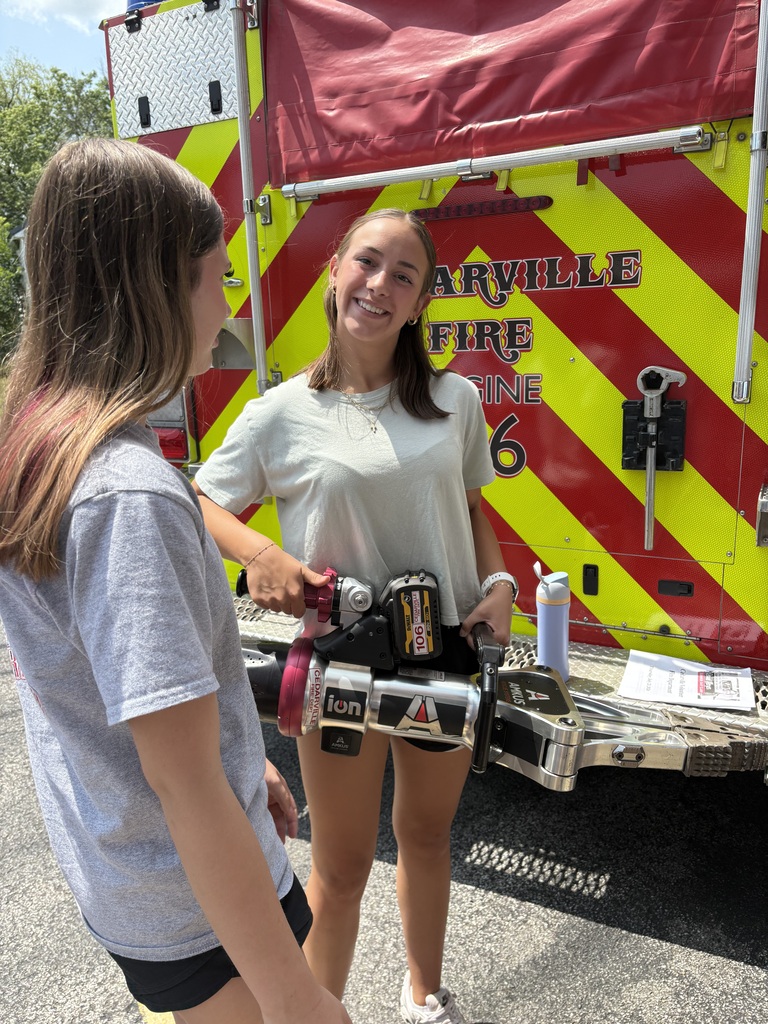 Two students outside ambulance