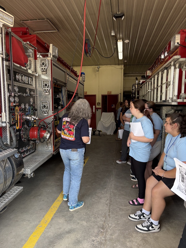 Students and presenter in fire house