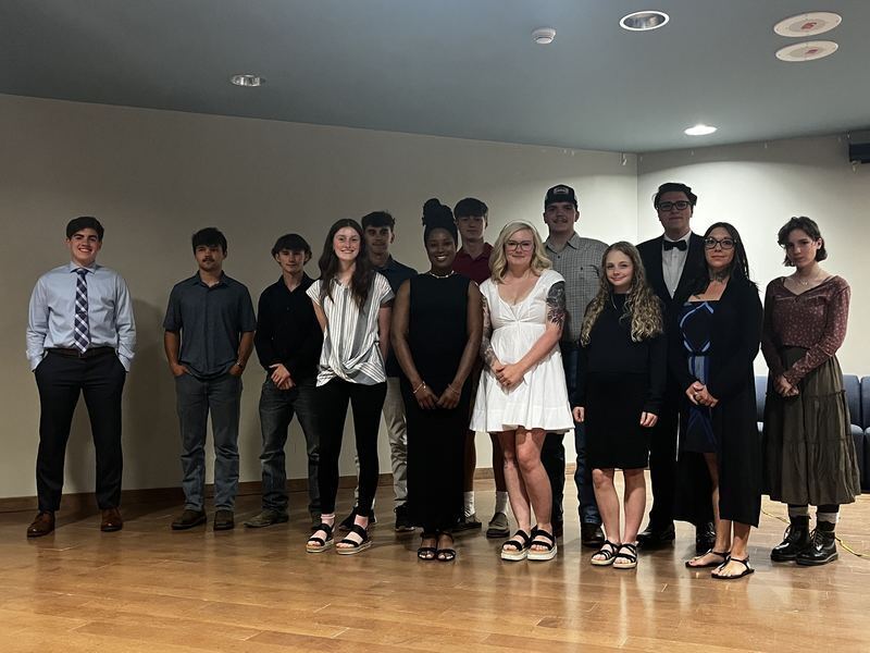 2024-25 scholarship award winners pose on stage