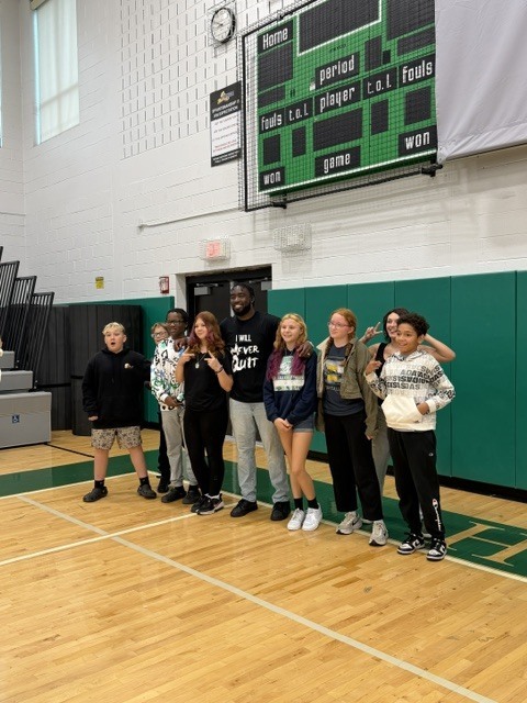 Dunkan Kirkwood posing with Herkimer CSD students