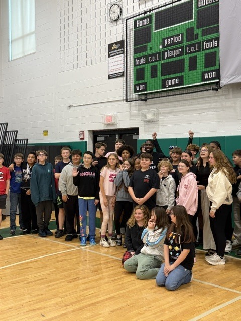 Dunkan Kirkwood posing with Herkimer CSD students