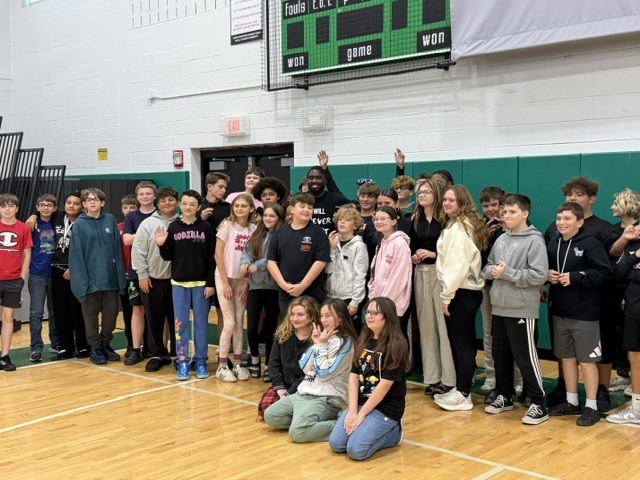 Dunkan Kirkwood posing with Herkimer CSD students