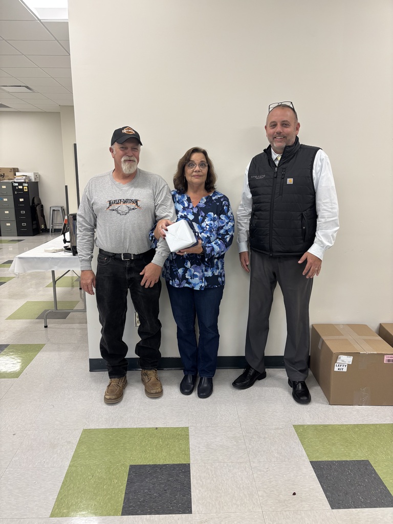 Diana Cassidy (center), her husband Brian (left), and D.J. Shepardson (right).