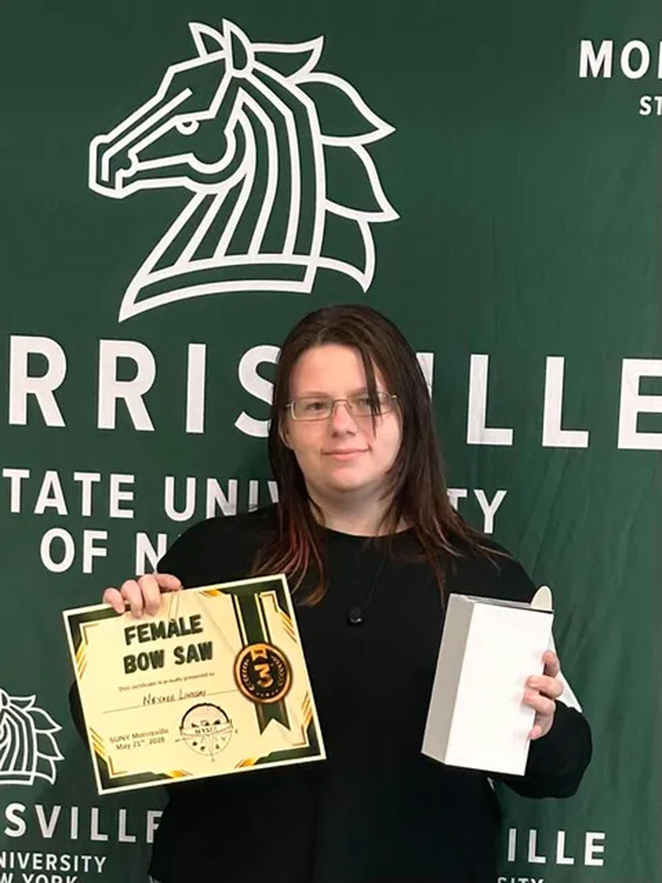 Student posing with certificate at state conservation competition