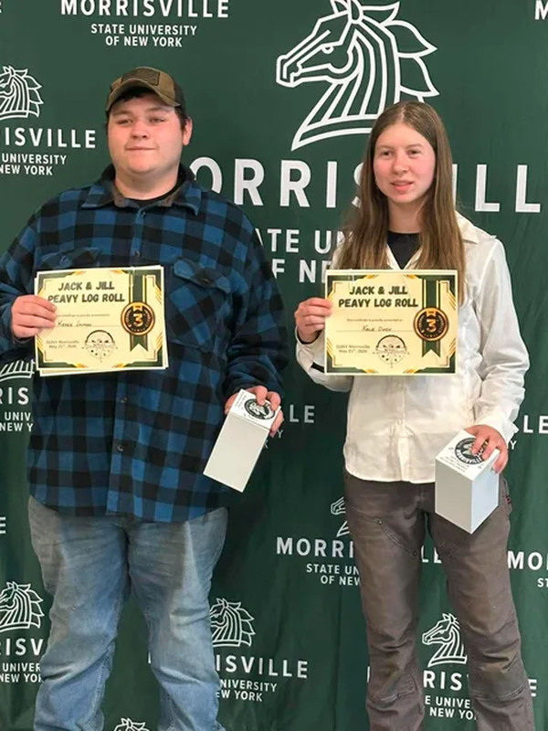 Two students posing with certificate at state conservation competition