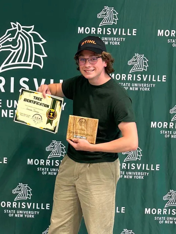 Student posing with certificate at state conservation competition