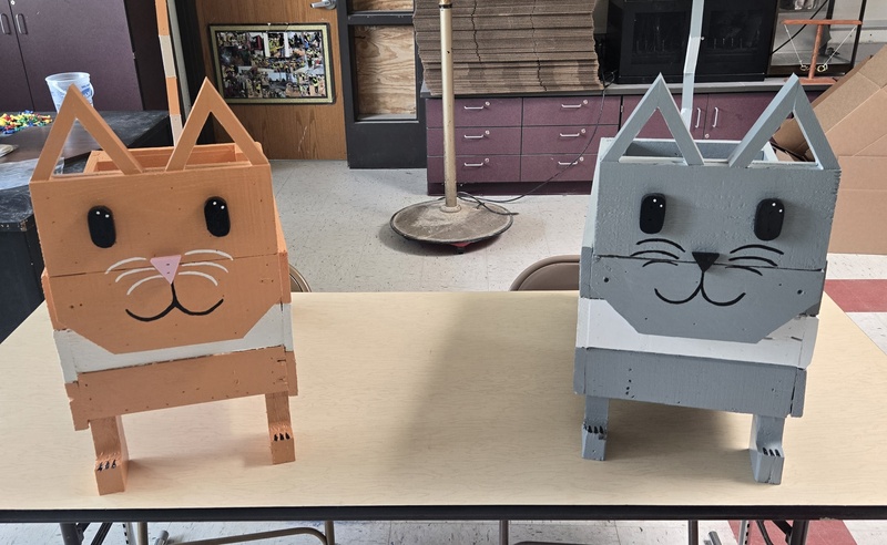 two cat-themed flower boxes