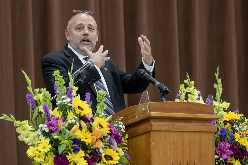 D.J. Shepardson speaking at podium at Completion Ceremony