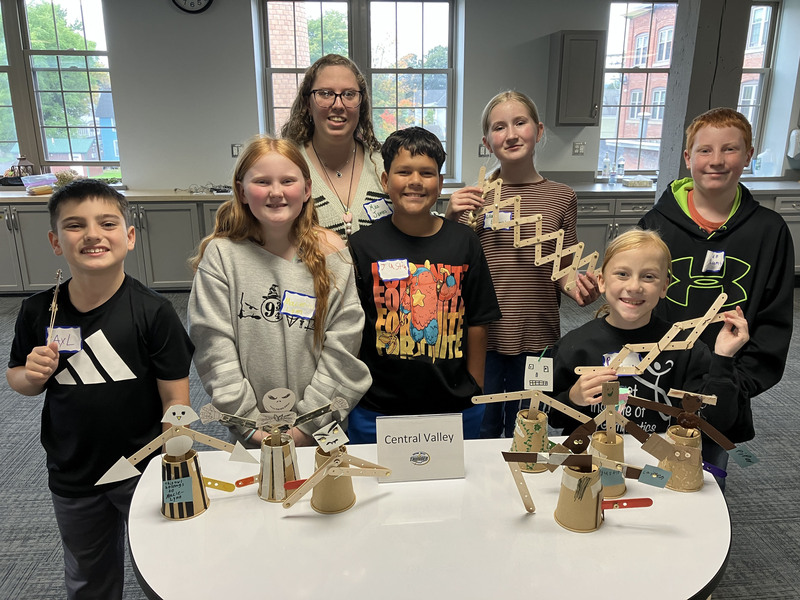 Students posing with engineering projects