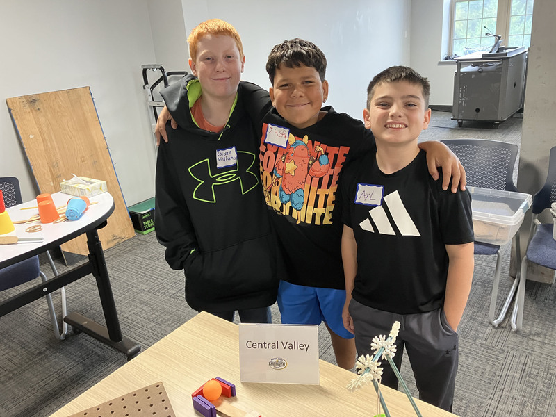 Students posing with engineering projects