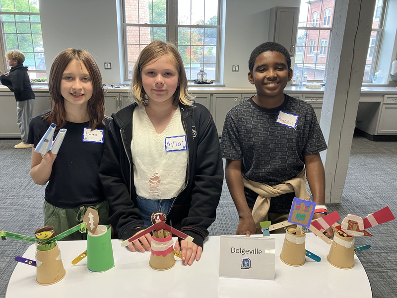 Students posing with engineering projects