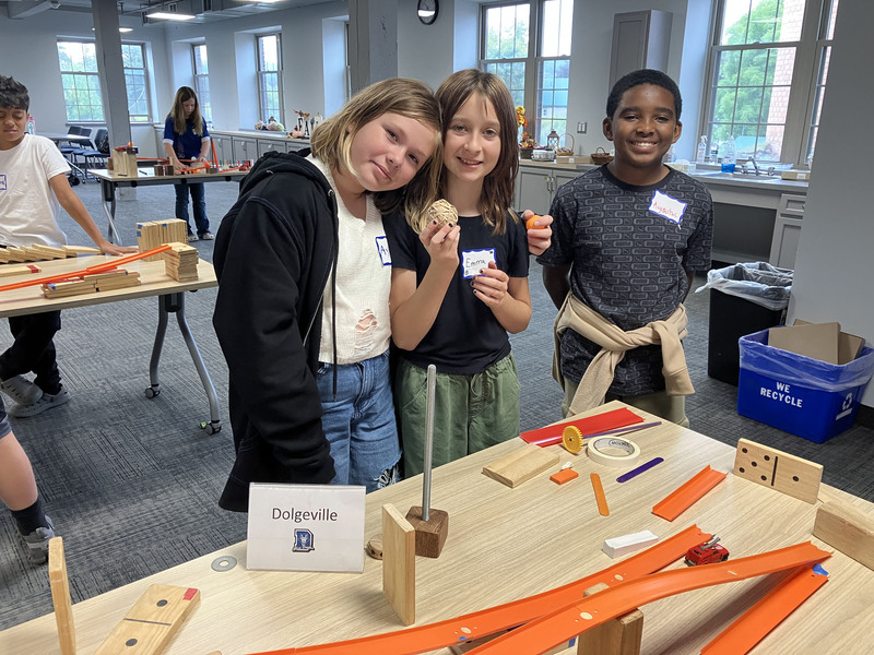 Students posing with engineering projects