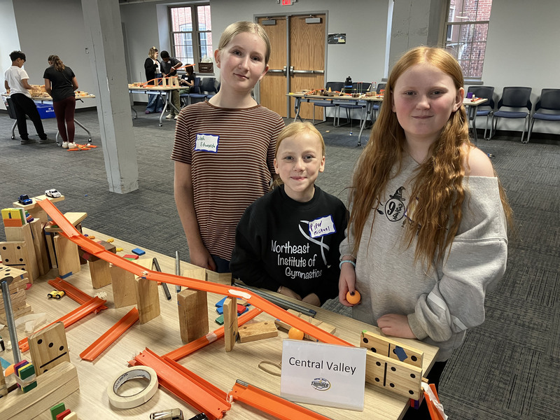 Students posing with engineering projects